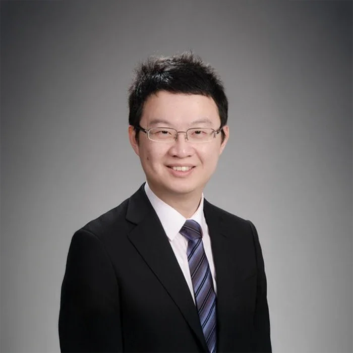 A professional photo of Dr. Meng-Hsiu 'Matthew' Ho wearing a suit